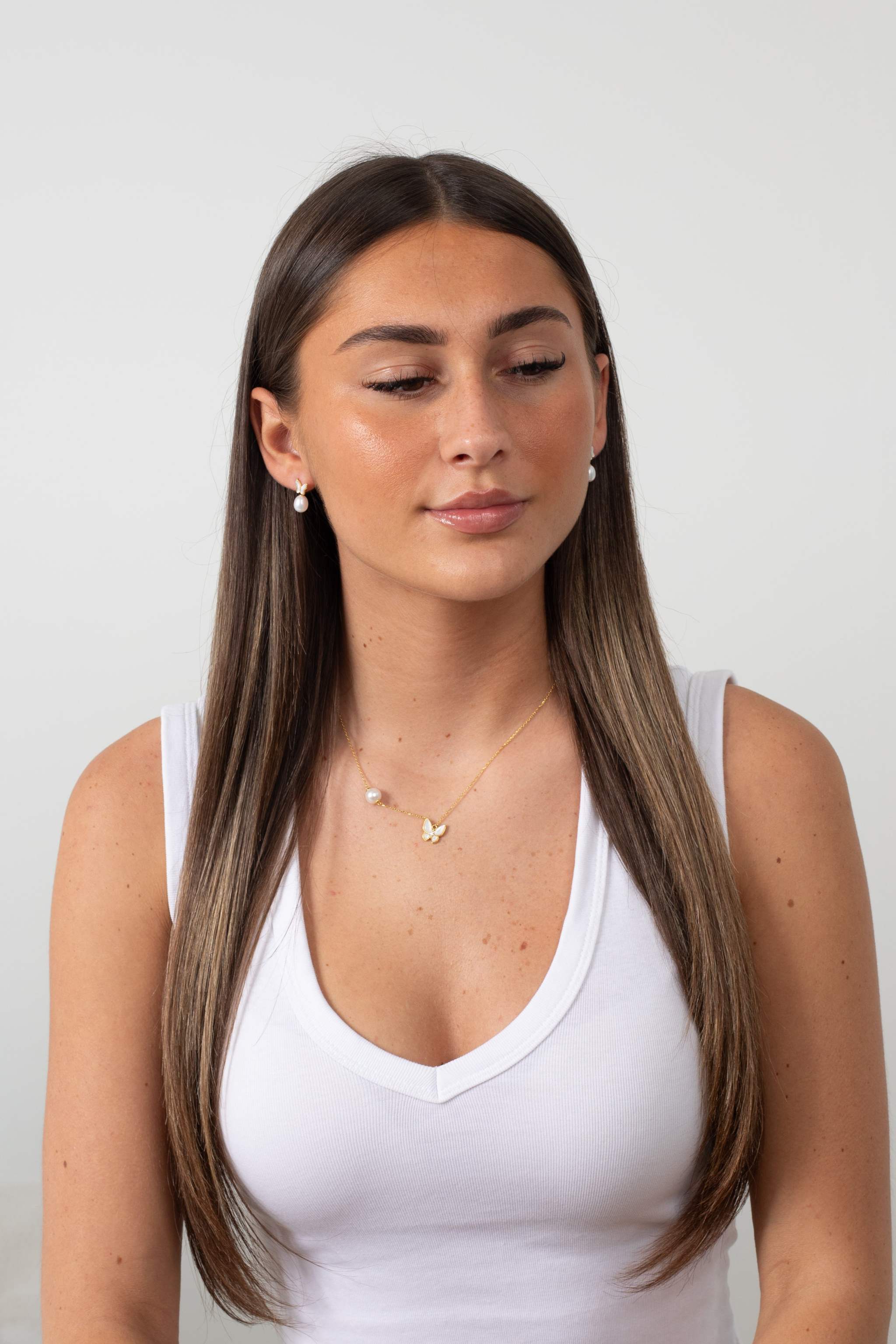 Butterfly Pearl Whisper earrings featuring gold butterfly design with freshwater pearl drops
