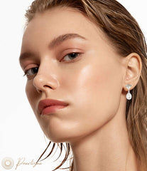 Model wearing the timeless and refined Victorious Pearl Vogue earrings