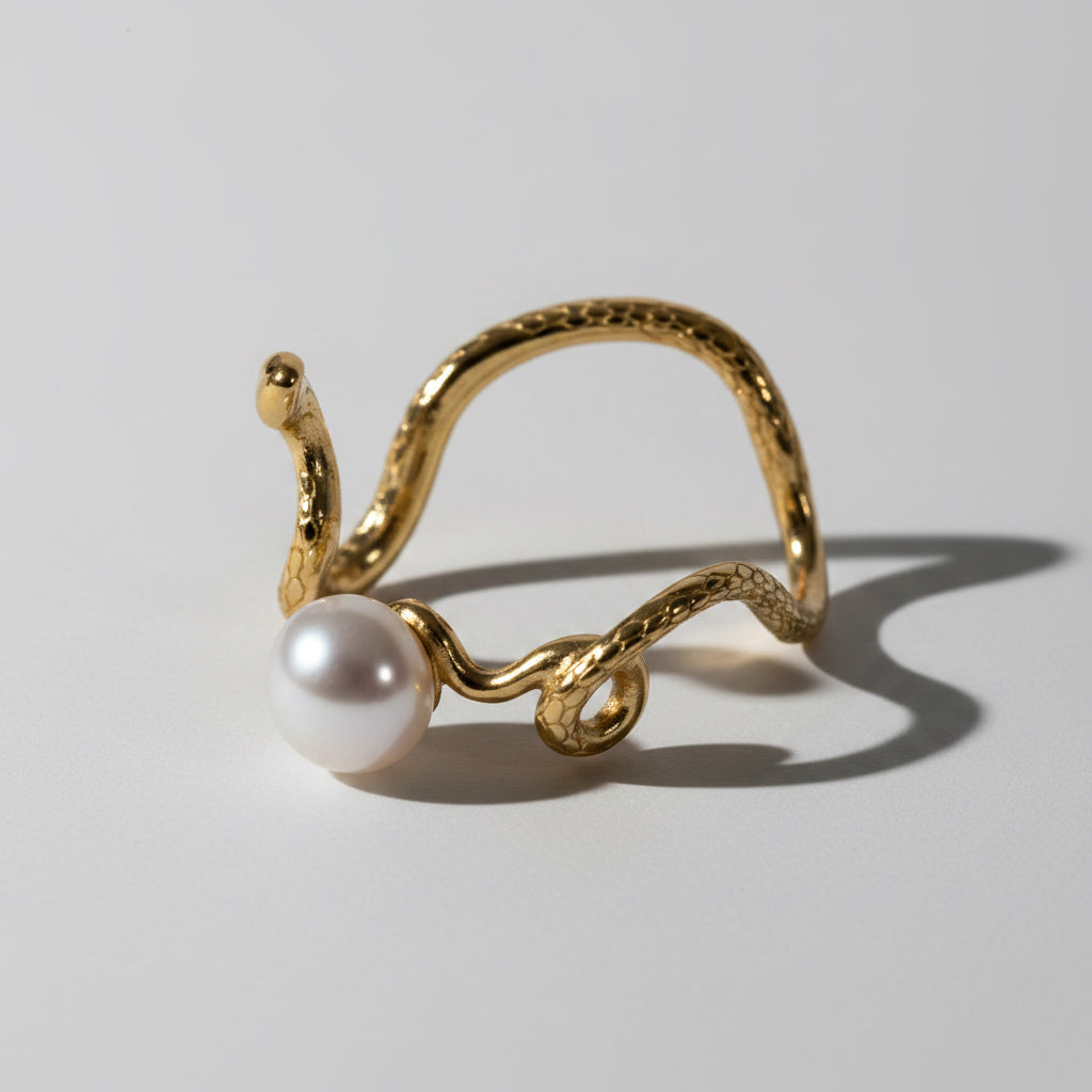 Close-up of Pearlisma Lilith Pearl Ring showing elegant snake-shaped band with pearl accent.