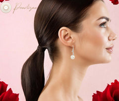 Model wearing Vintage Aqua Luminescence earrings with freshwater pearl drops