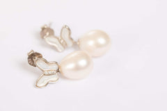 Butterfly Pearl Whisper earrings featuring gold butterfly design with freshwater pearl drops