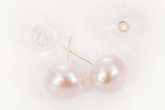 Majesty Drops earrings displayed with soft lighting highlighting pearl sheen