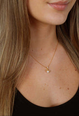 model showcasing bee pearl pendant necklace