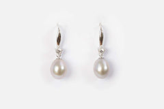 pair of pearl cascade earrings displayed on soft white background
