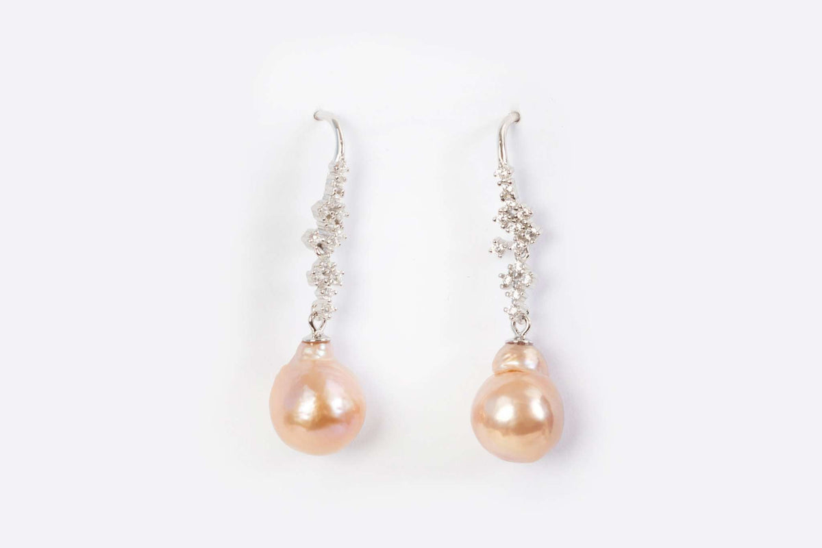 Pastel rose-toned freshwater pearl earrings with vintage silver detailing