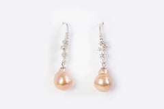 Pastel rose-toned freshwater pearl earrings with vintage silver detailing
