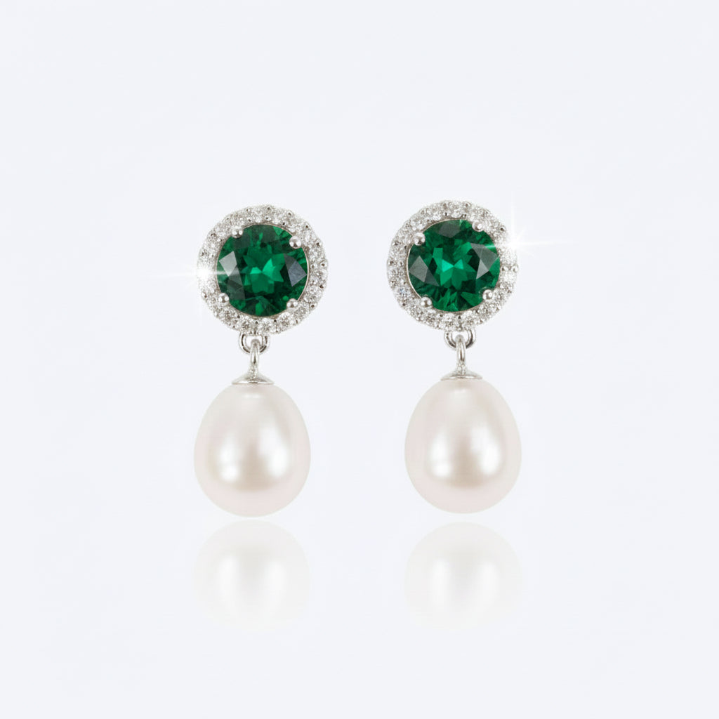 Majestic Green Pearl earrings displayed on a gold tray