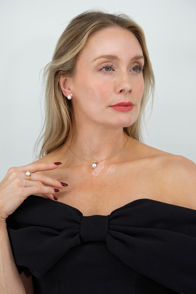 elegant lumiere pearl necklace worn with black dress