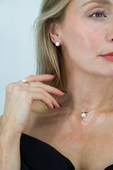 elegant lumiere pearl necklace worn with black dress