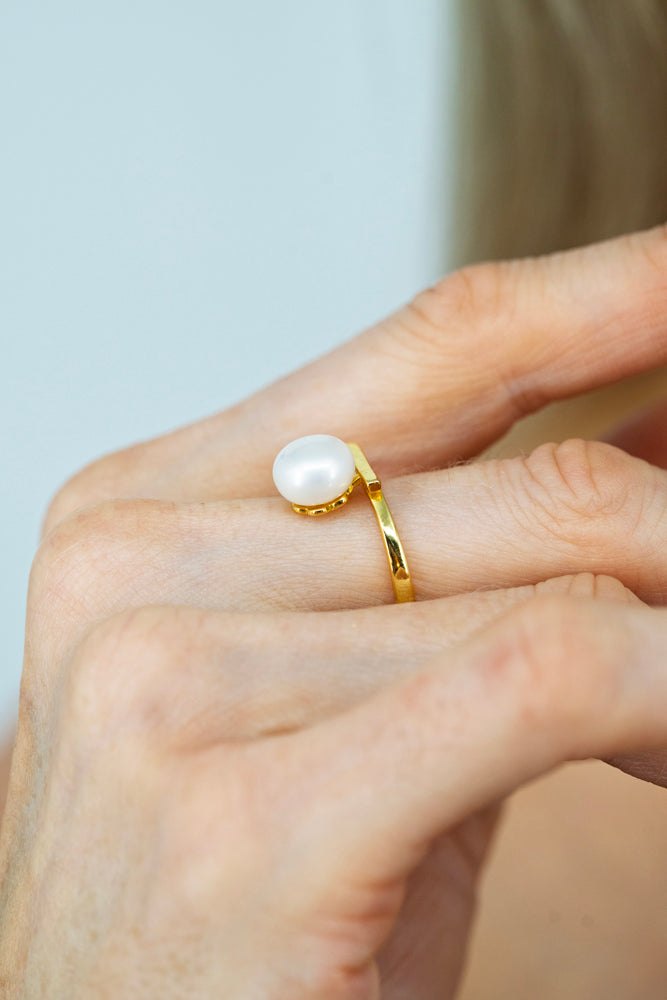 elegant lumiere pearl necklace worn with black dress