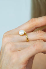 elegant lumiere pearl necklace worn with black dress