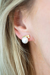 elegant lumiere pearl necklace worn with black dress