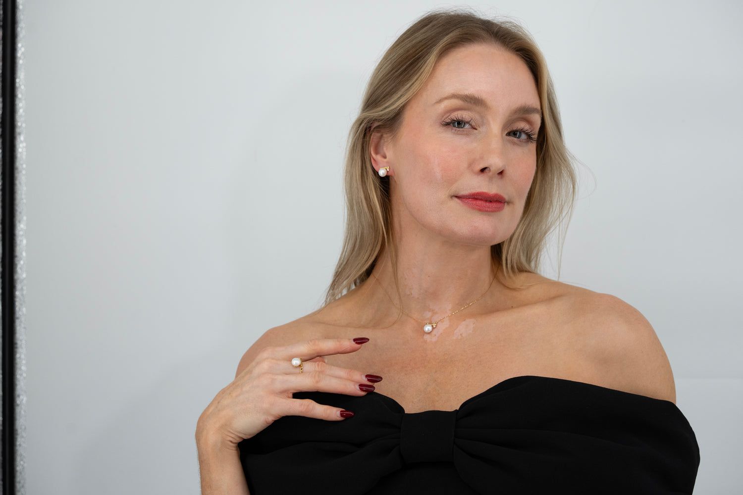 elegant lumiere pearl necklace worn with black dress