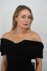 Woman wearing Fleur de Perle freshwater pearl necklace with yellow zircon pendant