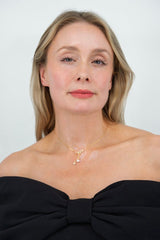 Close-up of The Pearl of My Heart freshwater pearl necklace styled with elegant outfit