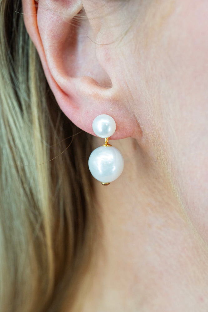 Flat lay of Classic Pearl Earrings with round and baroque freshwater pearls and gold plated details