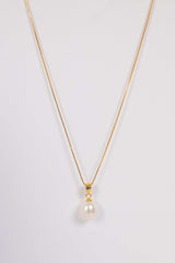 Majestic Lily pearl necklace featuring gold plated lily pendant and natural freshwater pearl