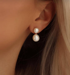 Woman wearing Classic Pearl Earrings featuring round and baroque freshwater pearls