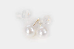 Close-up of Moonlight Serenade Pearl stud earrings in gold setting