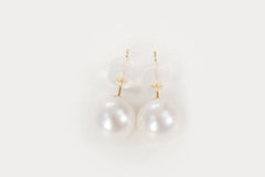 Elegant 7mm freshwater pearl stud earrings set in 18K gold