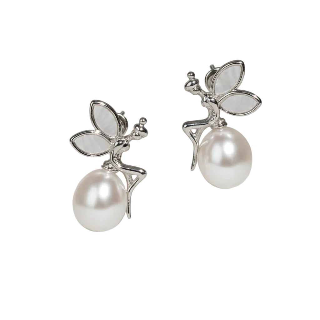 Close-up of Moonlit Fairytale Pearl stud earrings with shimmering silver details