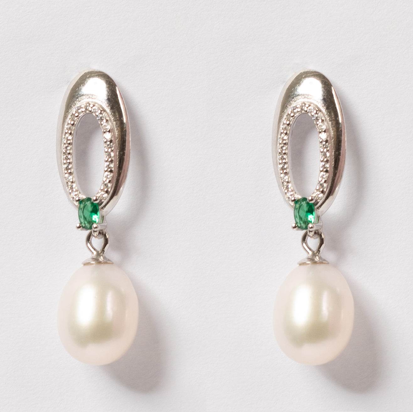 Enigma Pearl Drop Earrings featuring 7-8mm freshwater pearls with emerald accents