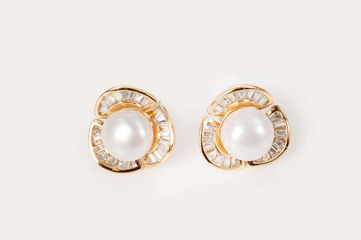 Classic design Rosette Pearl Studs featuring white freshwater pearls in silver setting