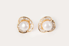 Classic design Rosette Pearl Studs featuring white freshwater pearls in silver setting