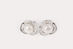 Rosette Pearl Studs with fresh white pearls, sterling silver accents, and classic design