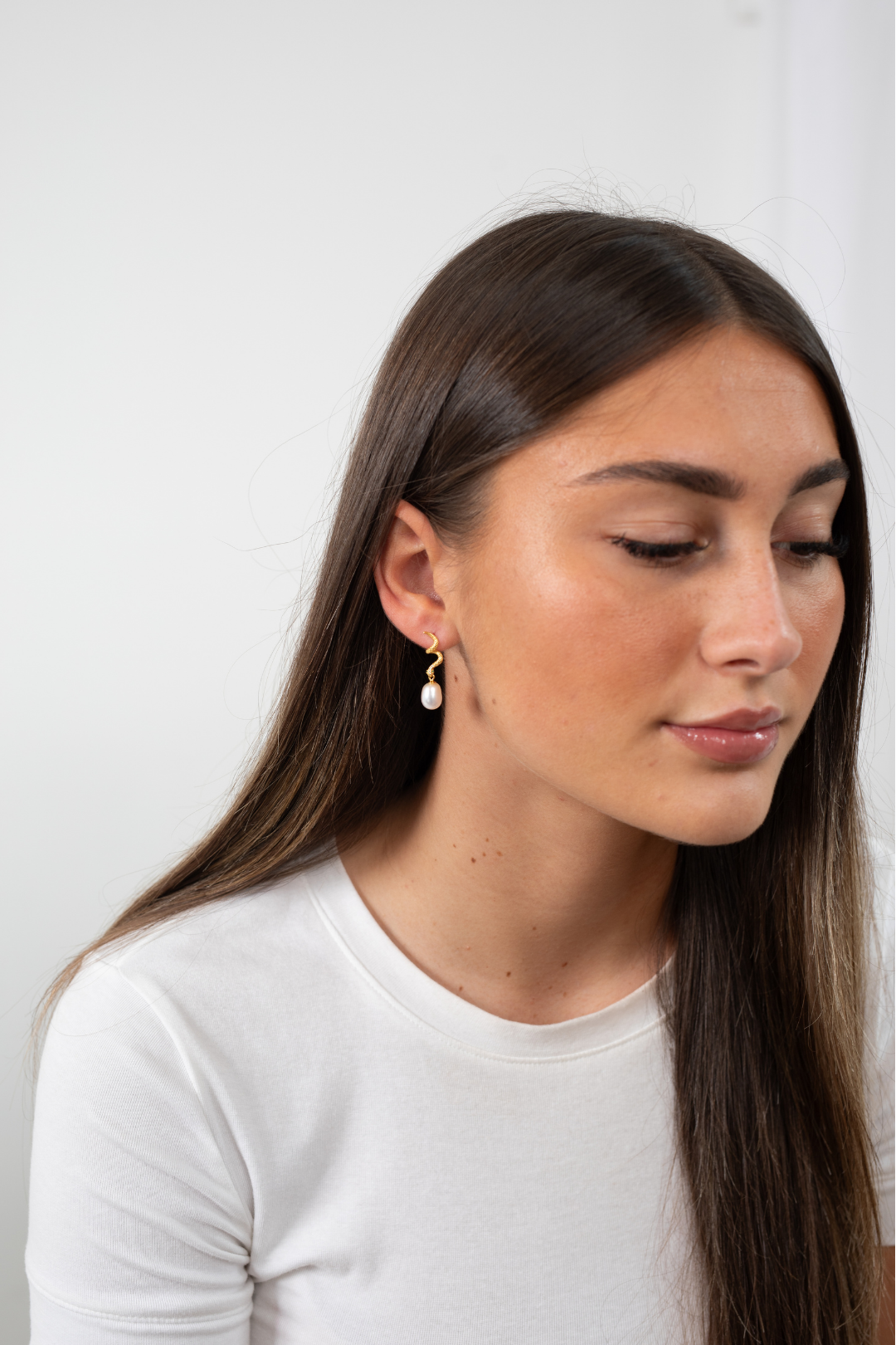 Close-up of Lilith Pearl Drop Earrings showing elegant freshwater pearl and gold detailing