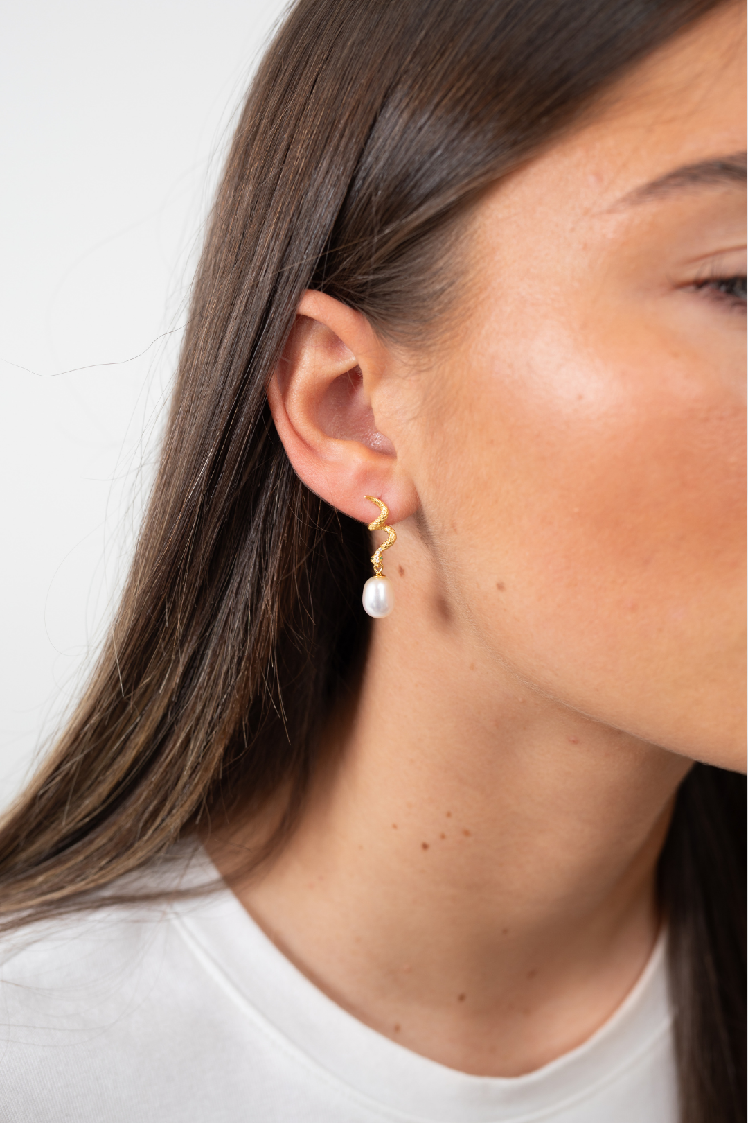 Lilith Pearl Drop freshwater pearl earrings styled with minimalist white outfit