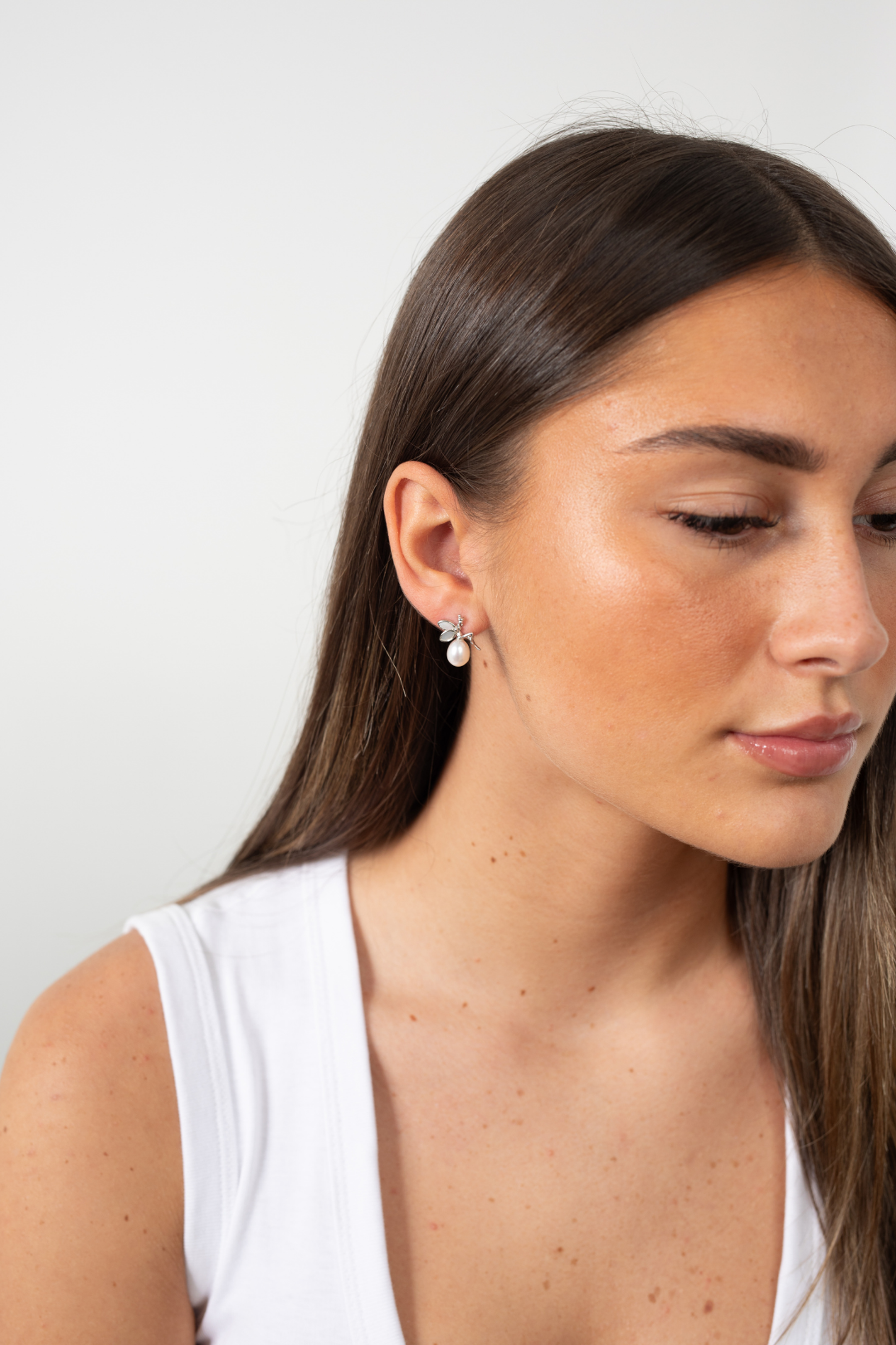 Model wearing Moonlit Fairytale Pearl earrings in sterling silver