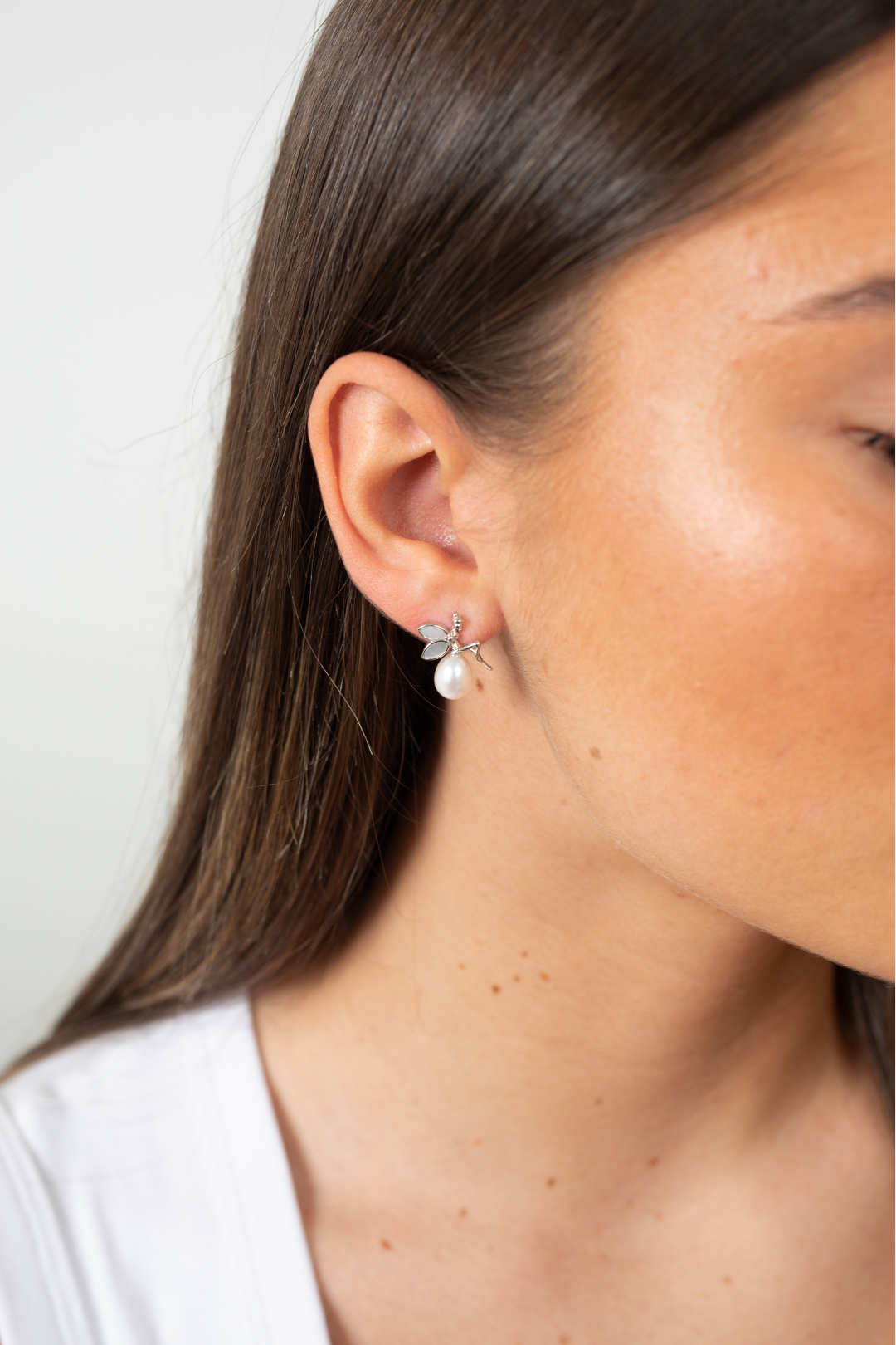Model wearing Moonlit Fairytale Pearl earrings in sterling silver